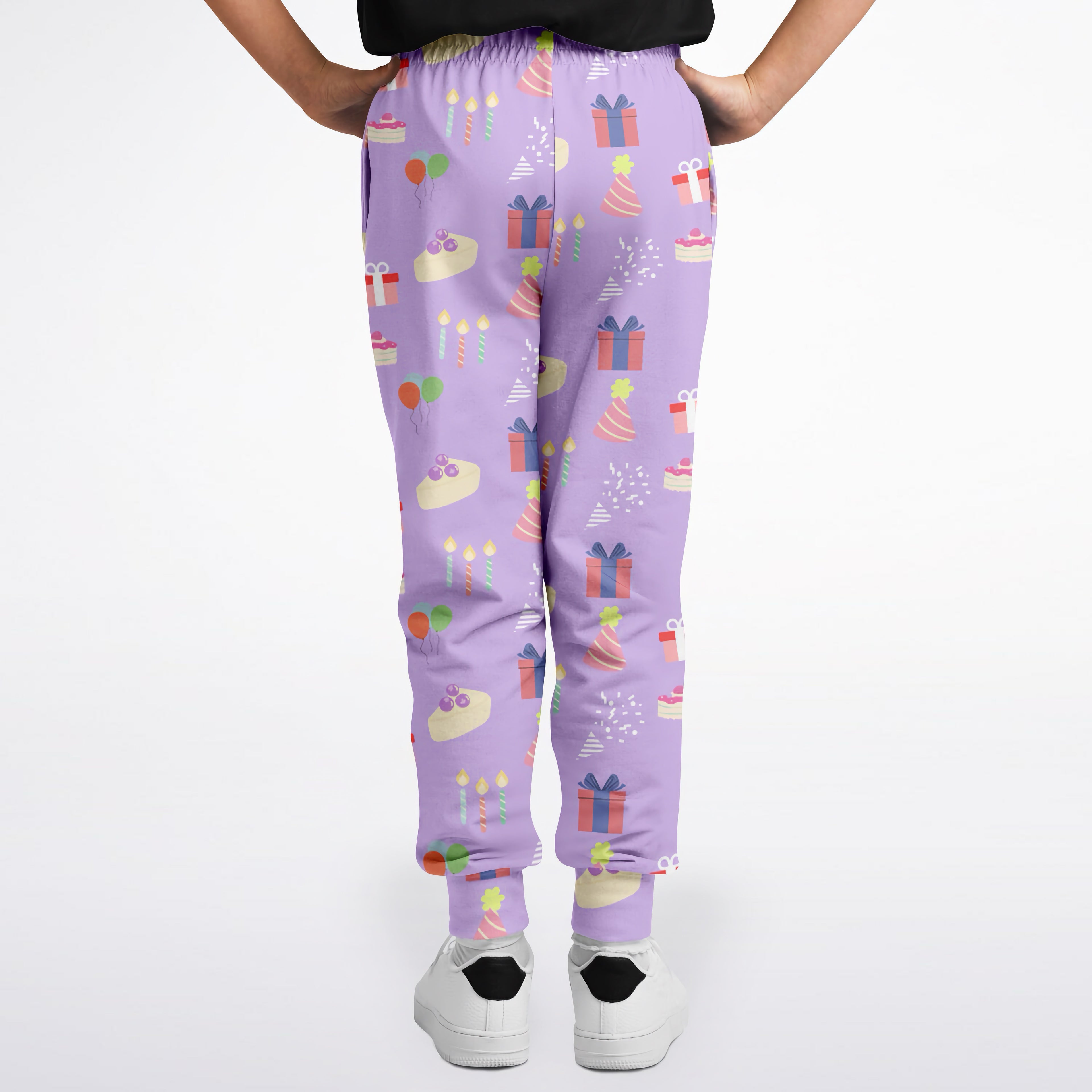 Girls birthday jogger pants in purple with colorful gift cake and candle pattern for festive casual wear