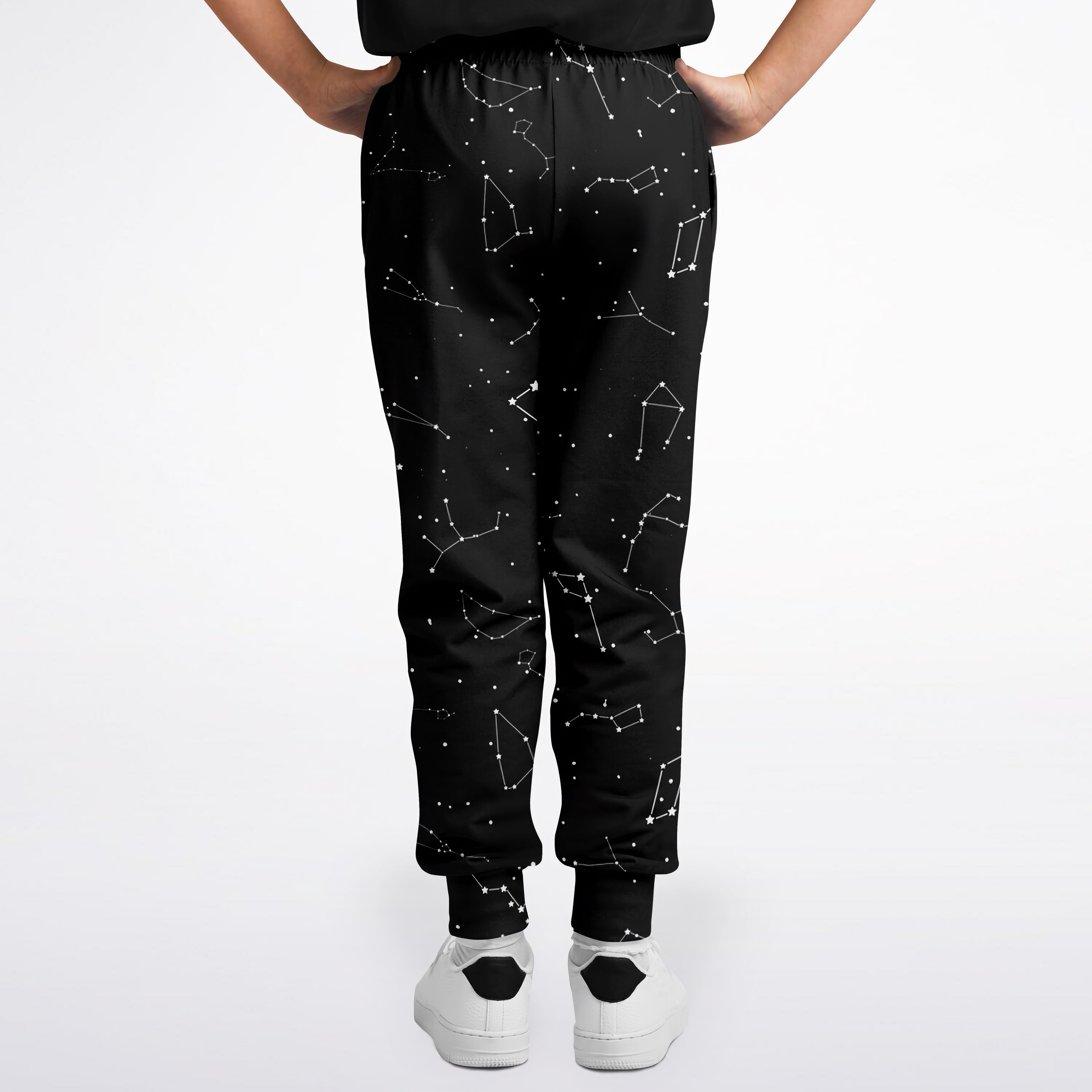 Black kids jogger pants with white realistic constellation pattern on soft fabric for comfortable everyday wear