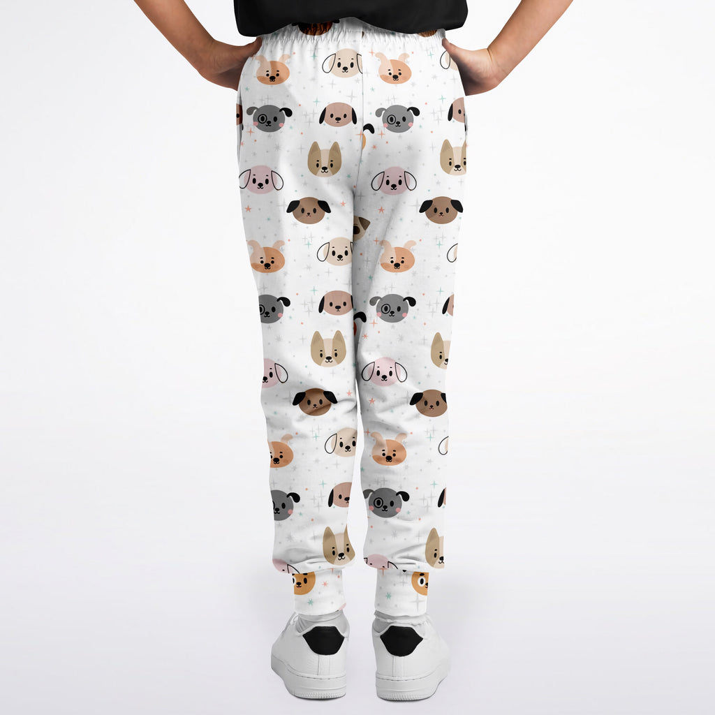 White kids dog face jogger pants with colorful cartoon dog pattern in beige gray and black