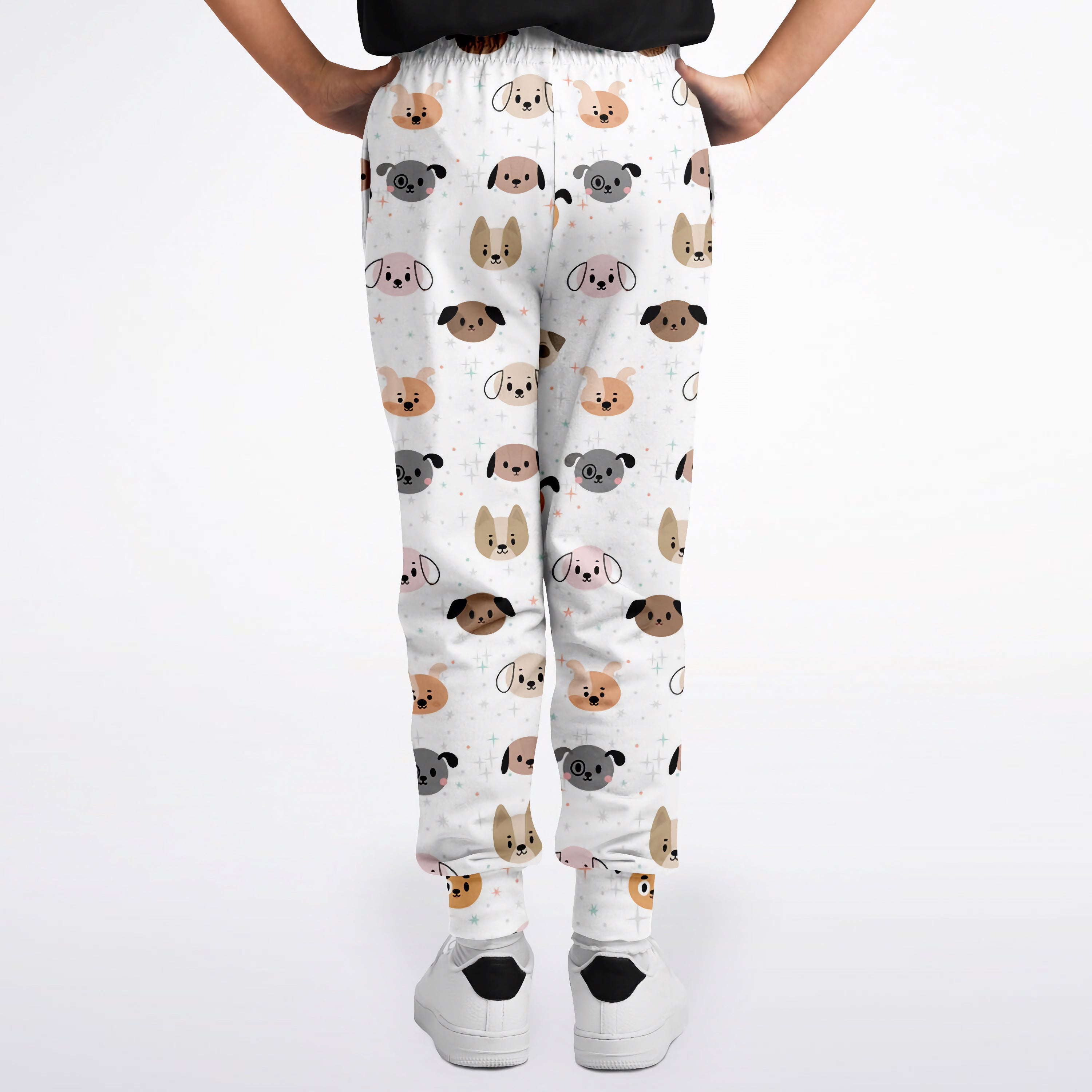 White kids dog face jogger pants with colorful cartoon dog pattern in beige gray and black
