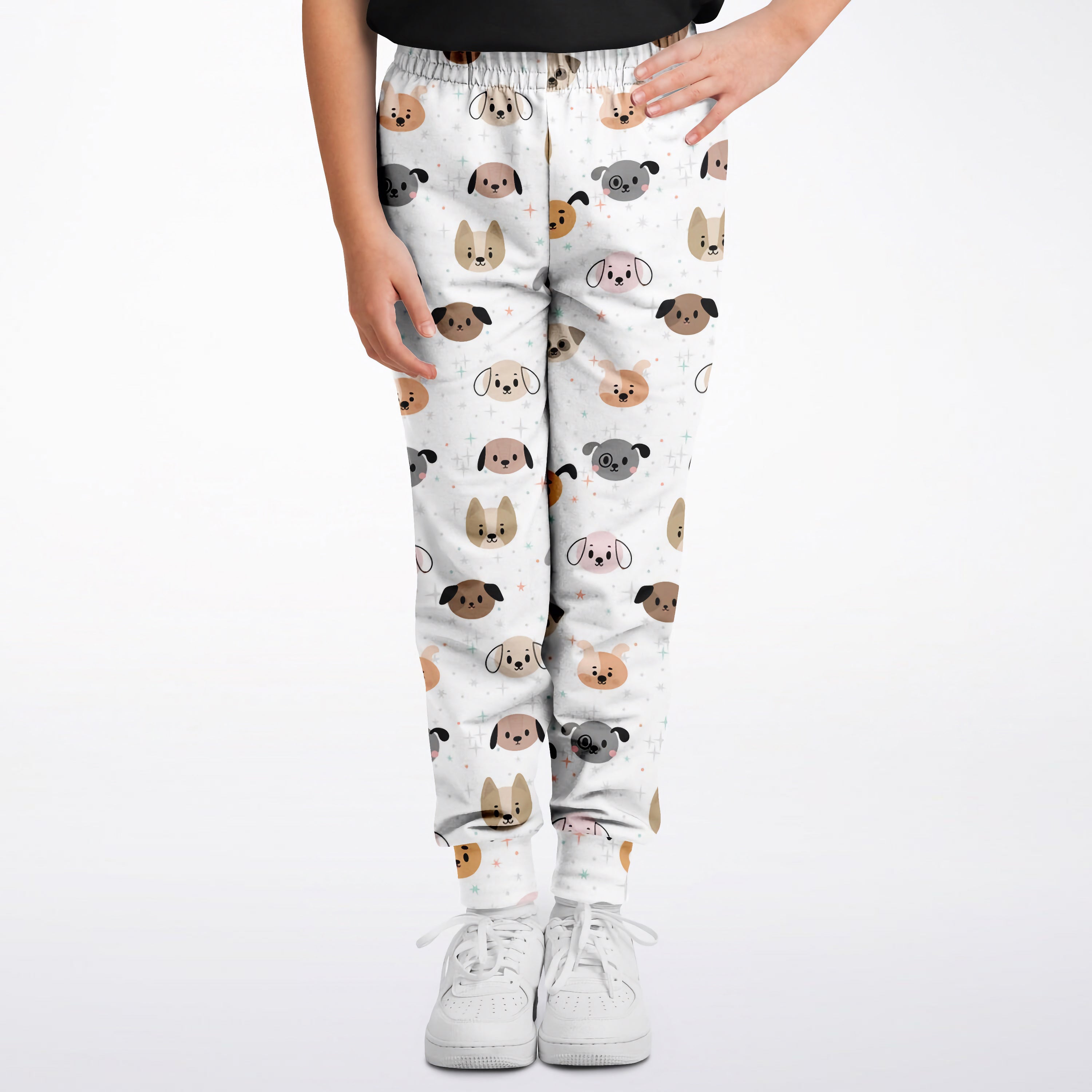White kids dog face jogger pants with colorful cartoon dog pattern in tan gray and pink for casual wear