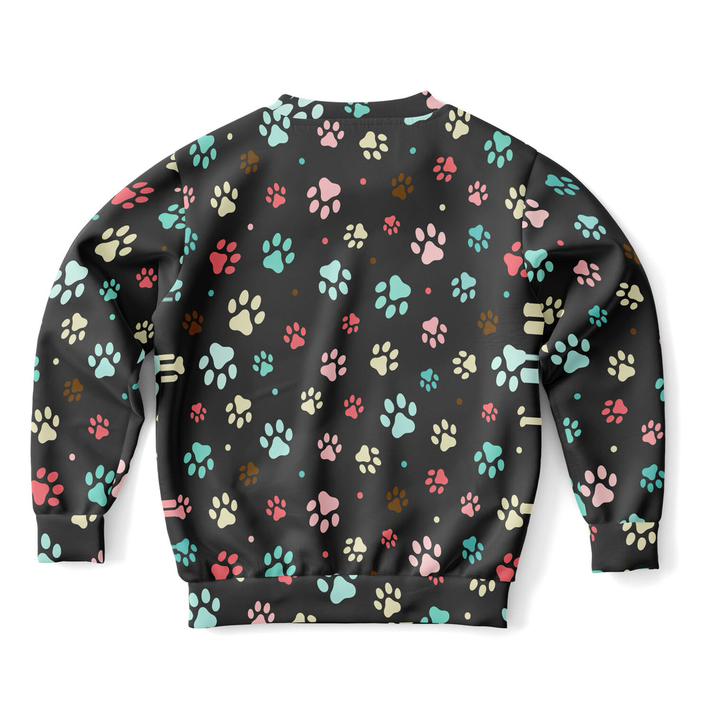 Black kids sweatshirt with colorful paw print pattern in pink teal cream and brown cozy cotton fleece fabric