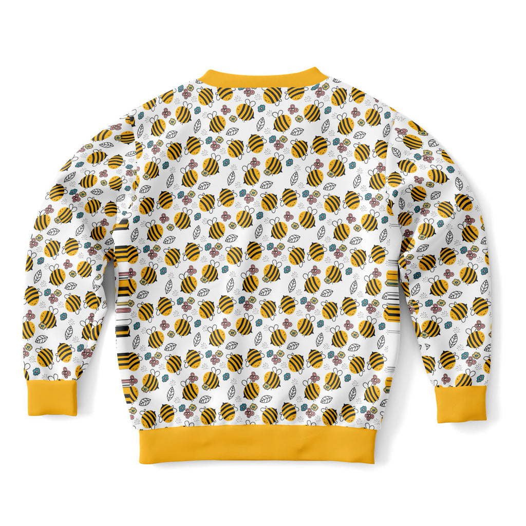Kids bumble bee sweatshirt in white with yellow trim featuring playful bee and floral patterns in cozy cotton fleece