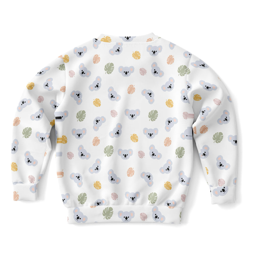 White kids koala bear sweatshirt with playful gray koalas and pastel tropical leaves in cozy cotton fleece fabric
