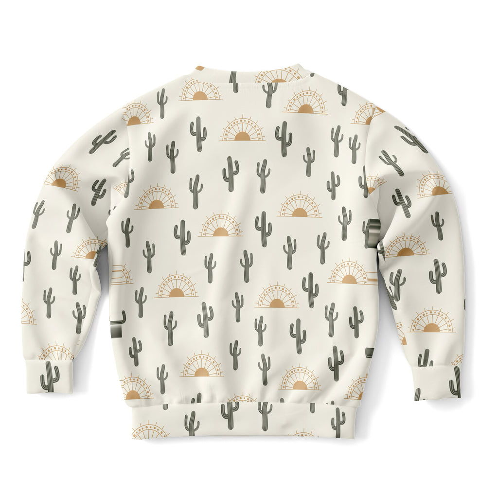 Cream-colored kids sweatshirt with black cactus and tan sunset pattern made of cozy cotton fleece fabric