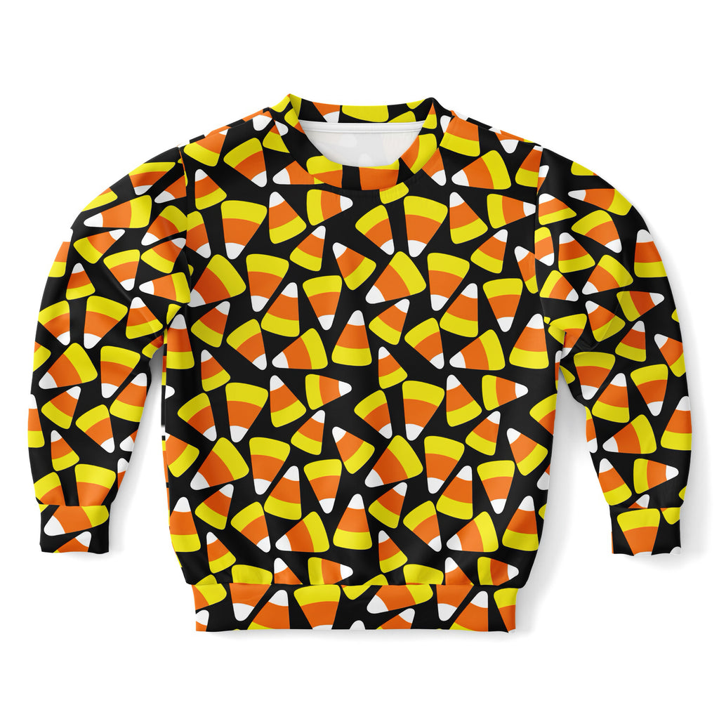 A black kids candy corn halloween sweatshirt with vibrant orange yellow white print in cozy cotton fleece fabric