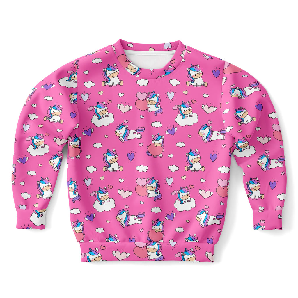 Pink girls sweatshirt with playful unicorn hearts print made of cozy cotton fleece or lightweight sports fabric