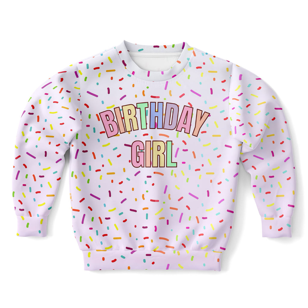 White long-sleeved birthday girl sweatshirt with colorful sprinkles in cozy cotton fleece or lightweight sports fabric