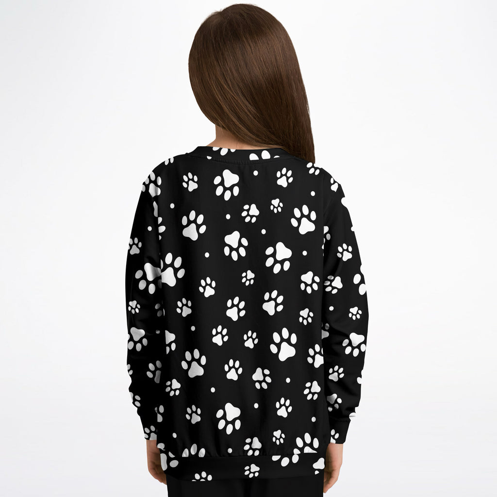 Black kids paw print sweatshirt in cozy cotton fleece with white paw print pattern on front for playful comfort