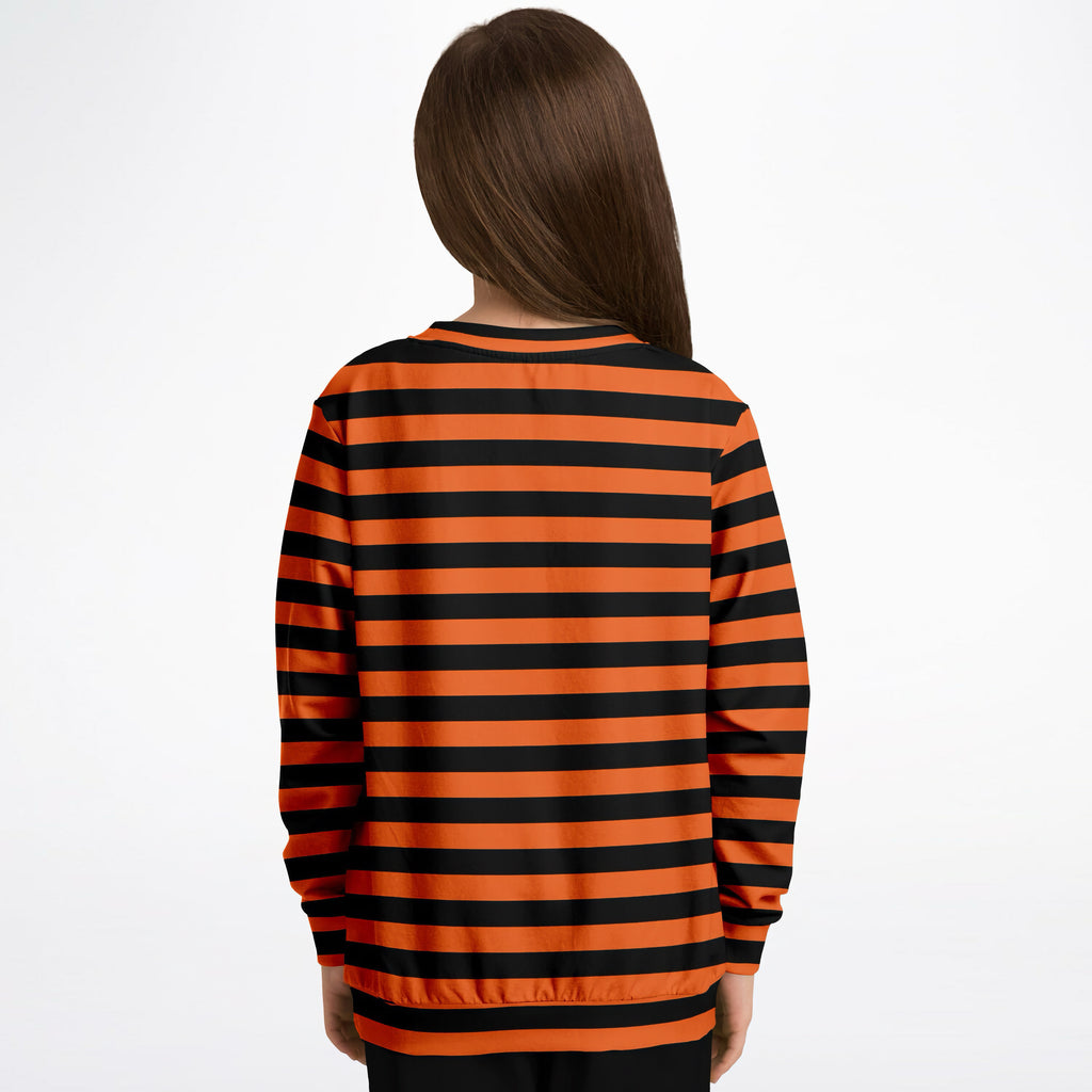 A child wearing a kids orange and black striped Halloween sweatshirt in cozy cotton fleece fabric