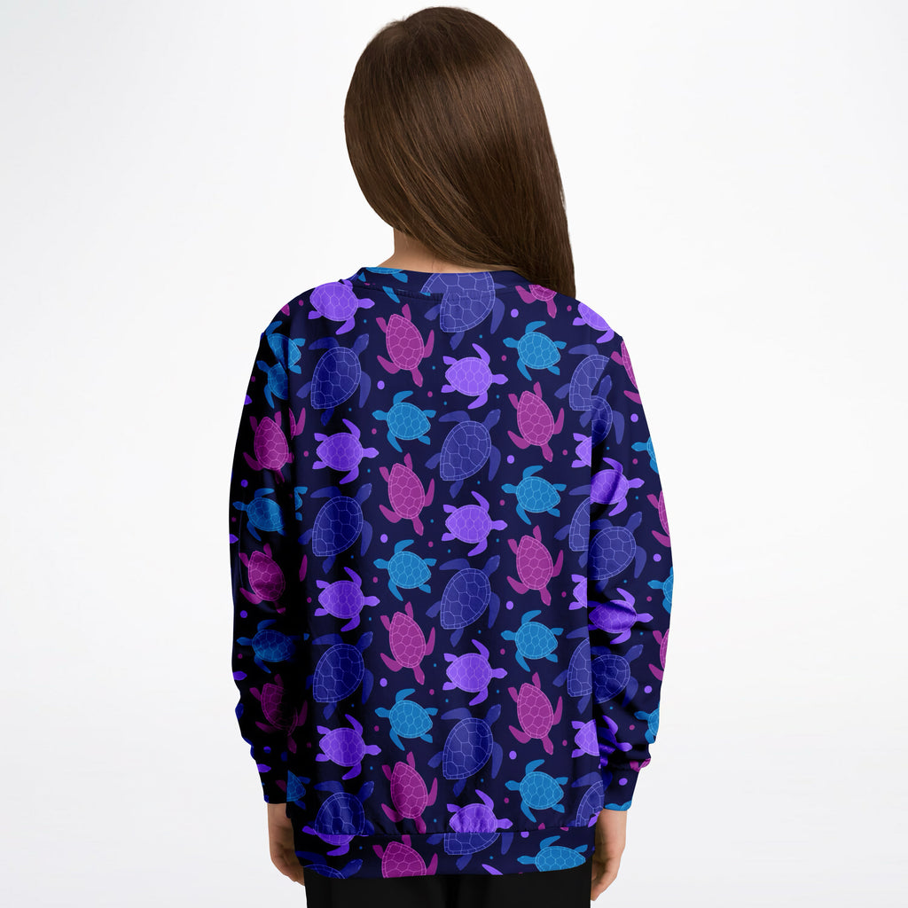 Navy blue girls sweatshirt with vibrant purple pink teal sea turtle pattern made from cozy cotton fleece or lightweight sports fabric