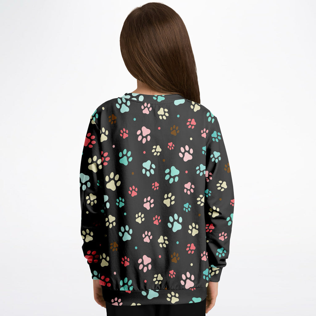 Black kids sweatshirt with colorful paw prints in pink teal cream and brown made of cozy cotton fleece or lightweight fabric