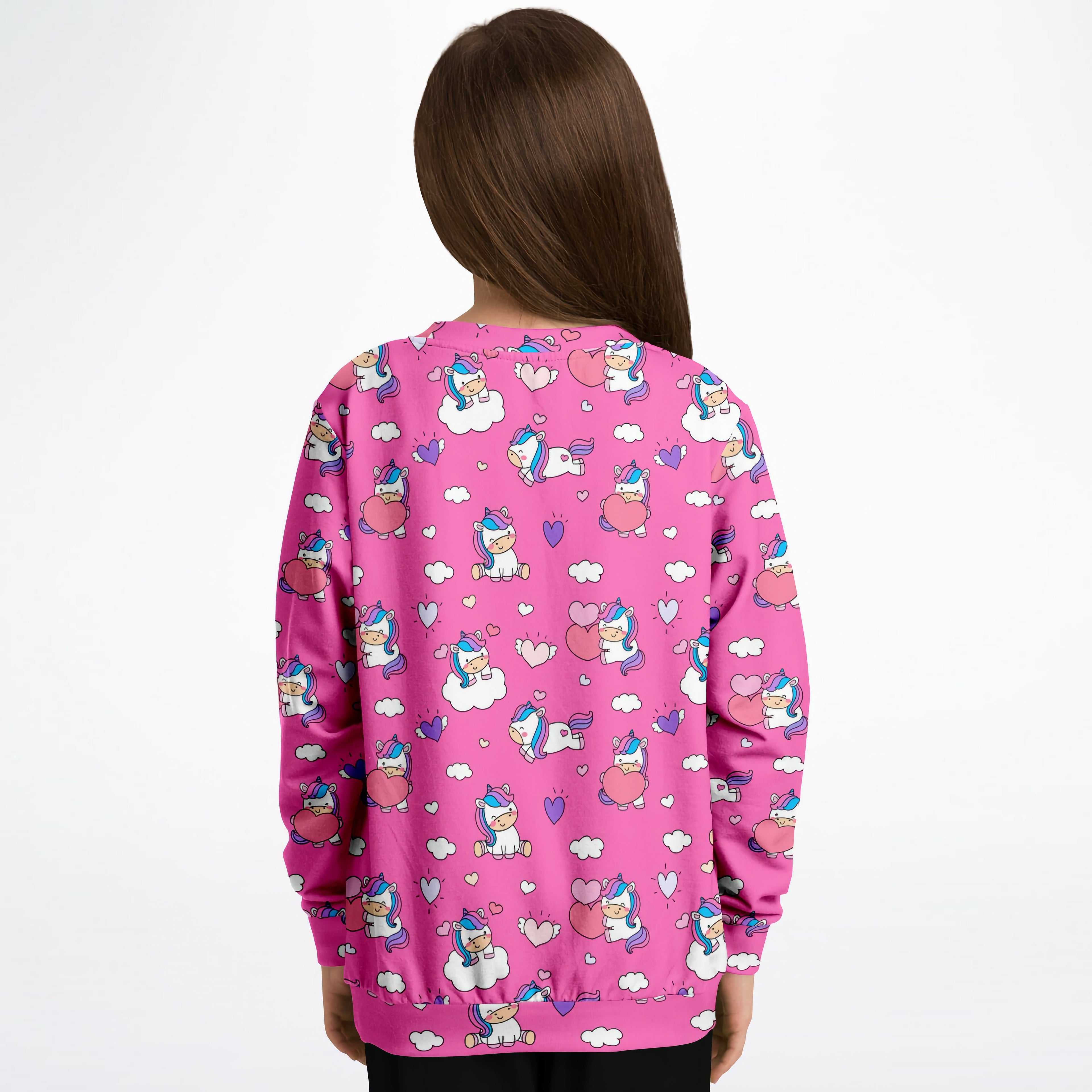 Pink girls sweatshirt with playful unicorn hearts print made of cozy cotton fleece or lightweight sports fabric