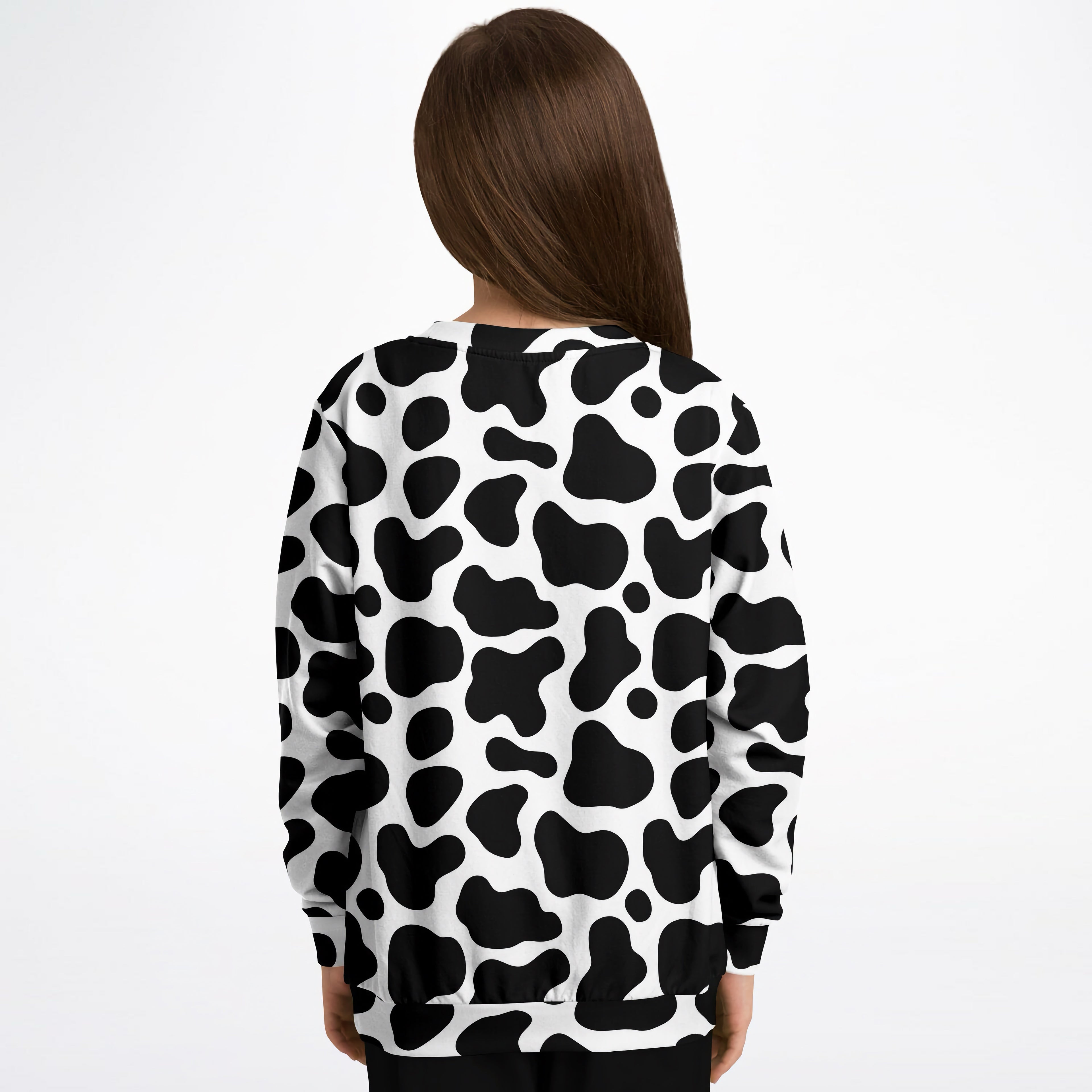 Kids cow print sweatshirt in black and white made of cozy cotton fleece for comfortable wear