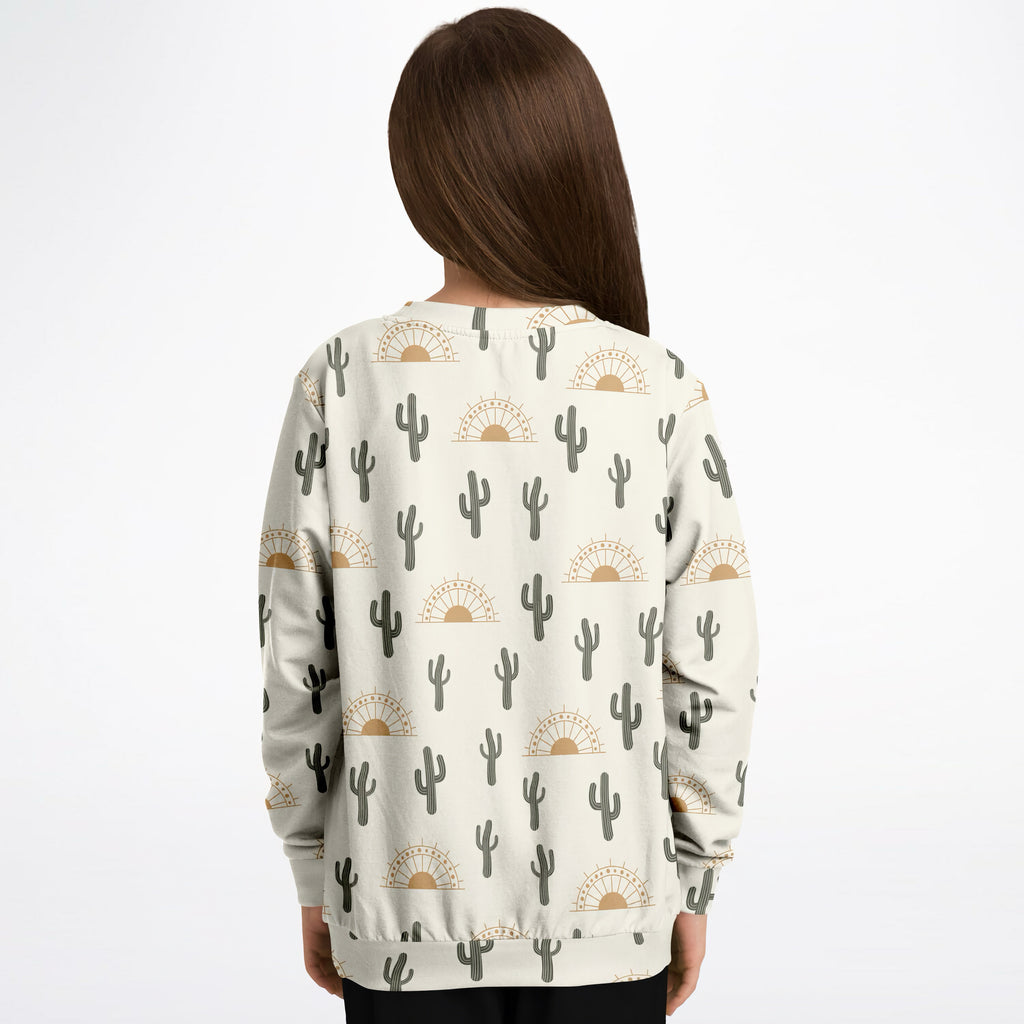 Kids cream-colored sweatshirt with gray cacti and tan suns pattern made of cozy cotton fleece or lightweight fabric