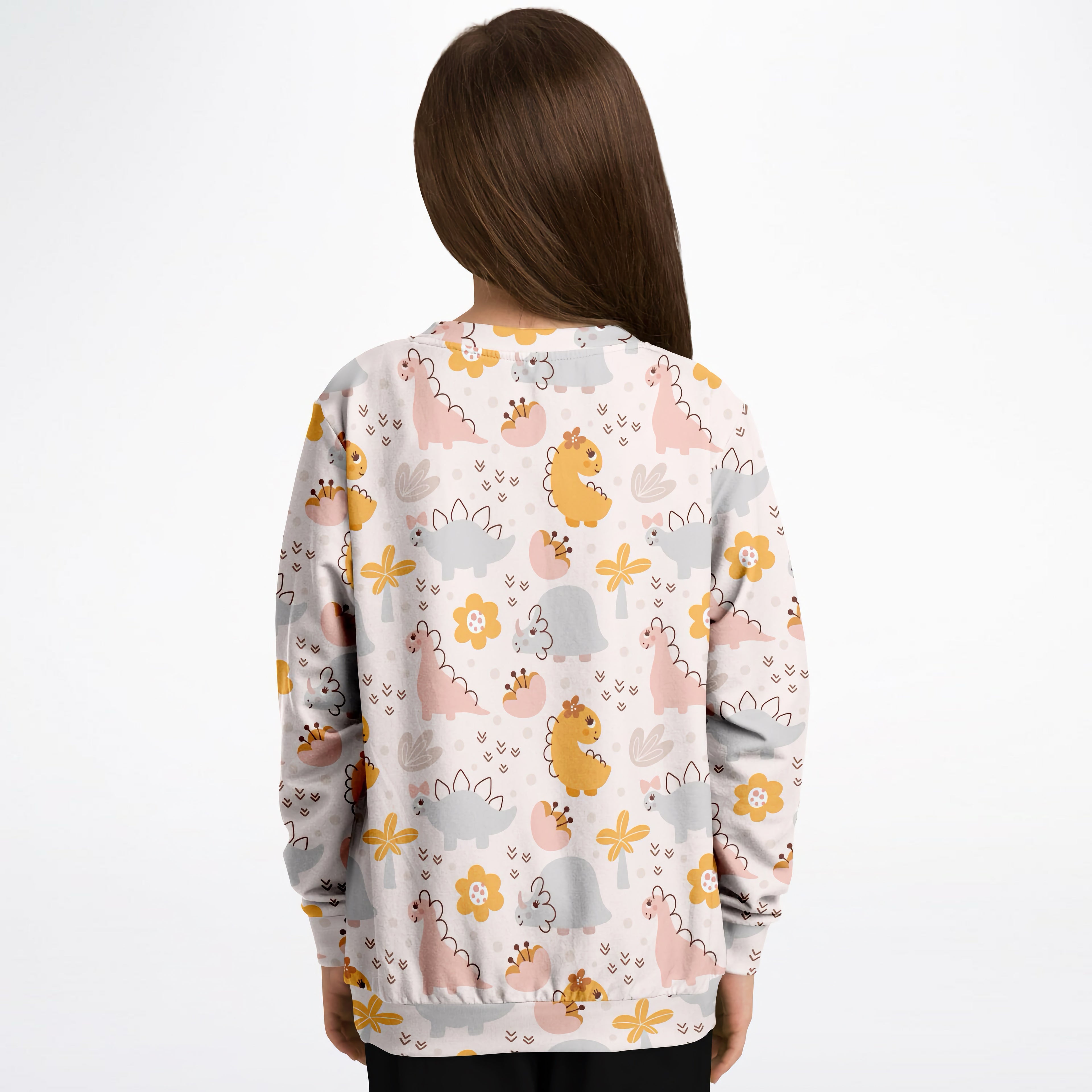 A child wearing a girls floral dinosaur sweatshirt in cozy cotton fleece with pastel pink and yellow dinos on gray background