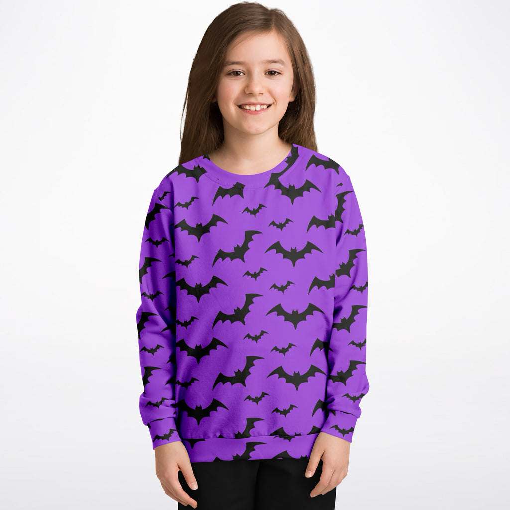 Kids purple long-sleeved sweatshirt with black bat patterns made of cozy cotton fleece for Halloween
