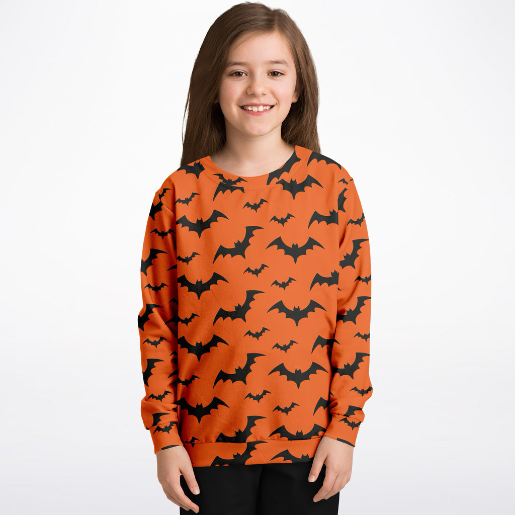 Kids orange long-sleeved sweatshirt with black bat patterns made of cozy cotton fleece or lightweight sports fabric