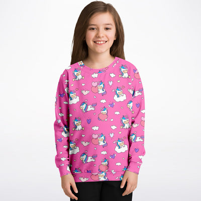 Pink girls sweatshirt with playful unicorn hearts and clouds pattern made of cozy cotton fleece or lightweight sports fabric