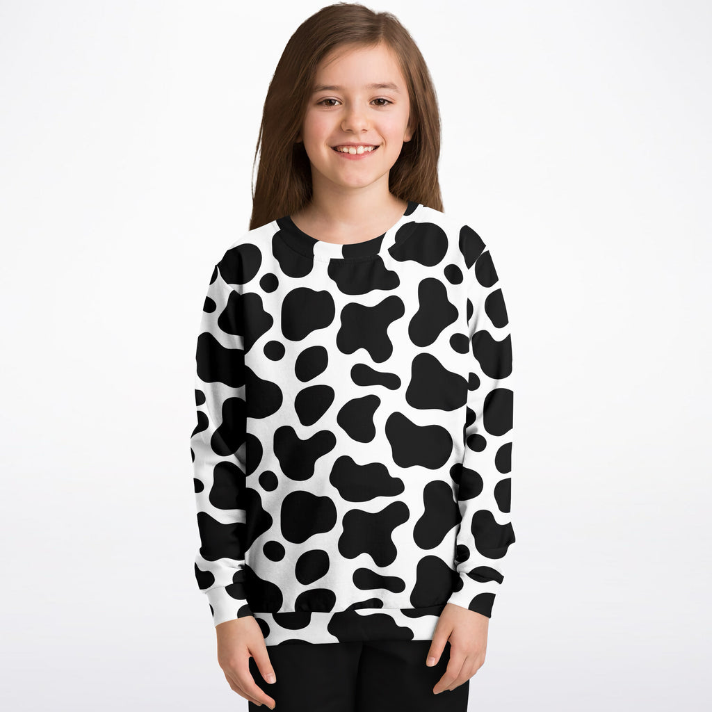 Kids cow print sweatshirt in black and white long sleeve made of cozy cotton fleece or lightweight sports fabric