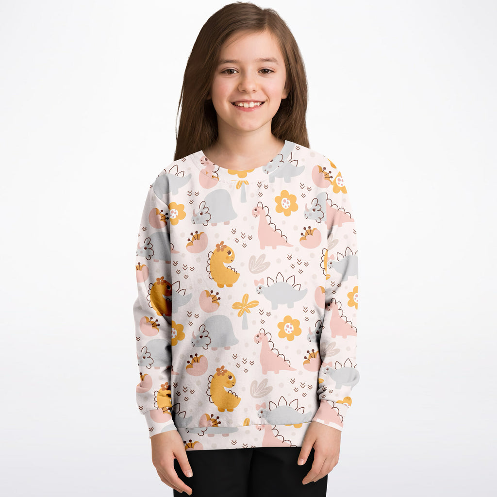 Girls floral dinosaur sweatshirt in cozy cotton fleece with pastel cartoon dinos and flowers on light background