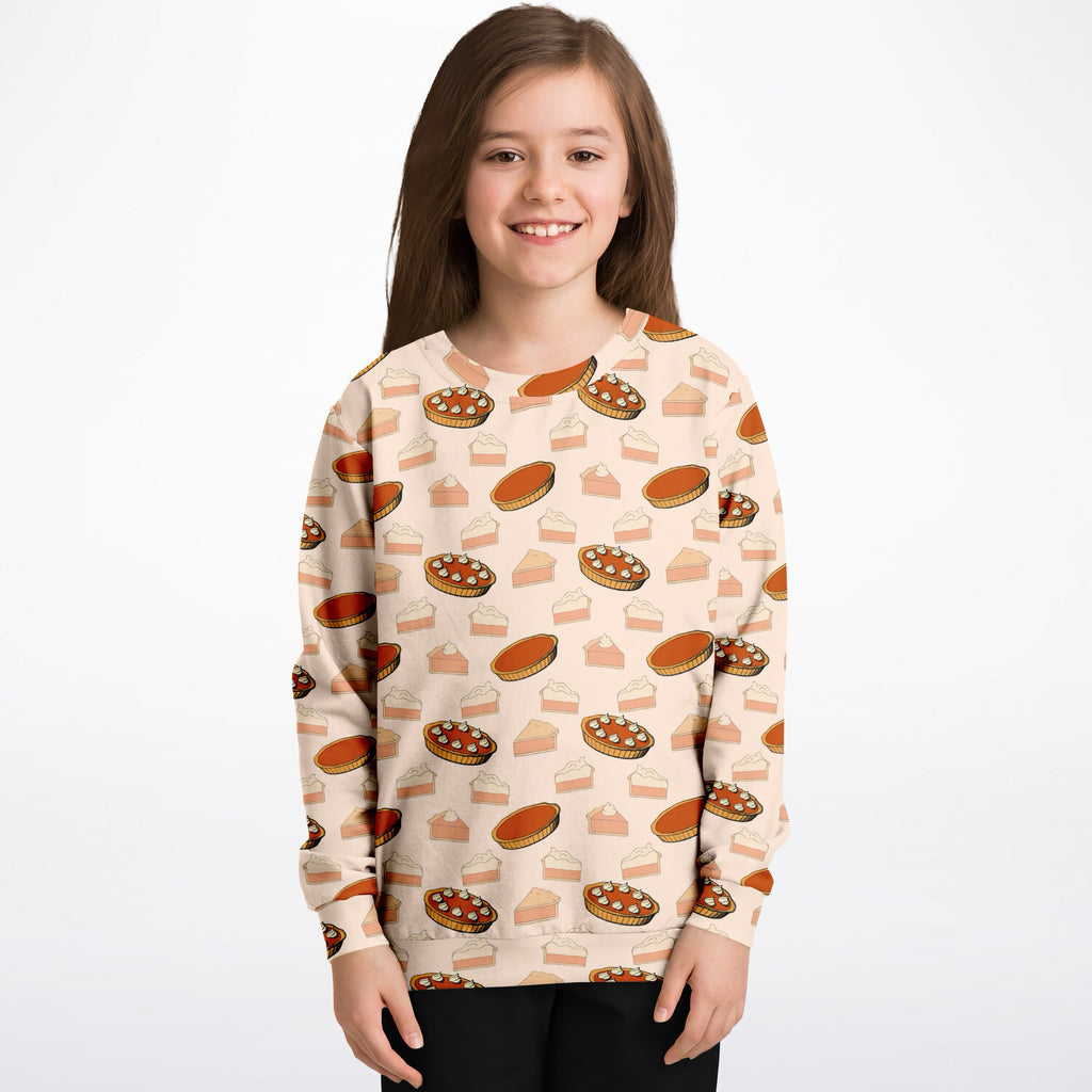 Beige kids pumpkin pie thanksgiving sweatshirt with playful cartoon pie print made from cozy cotton fleece or lightweight fabric
