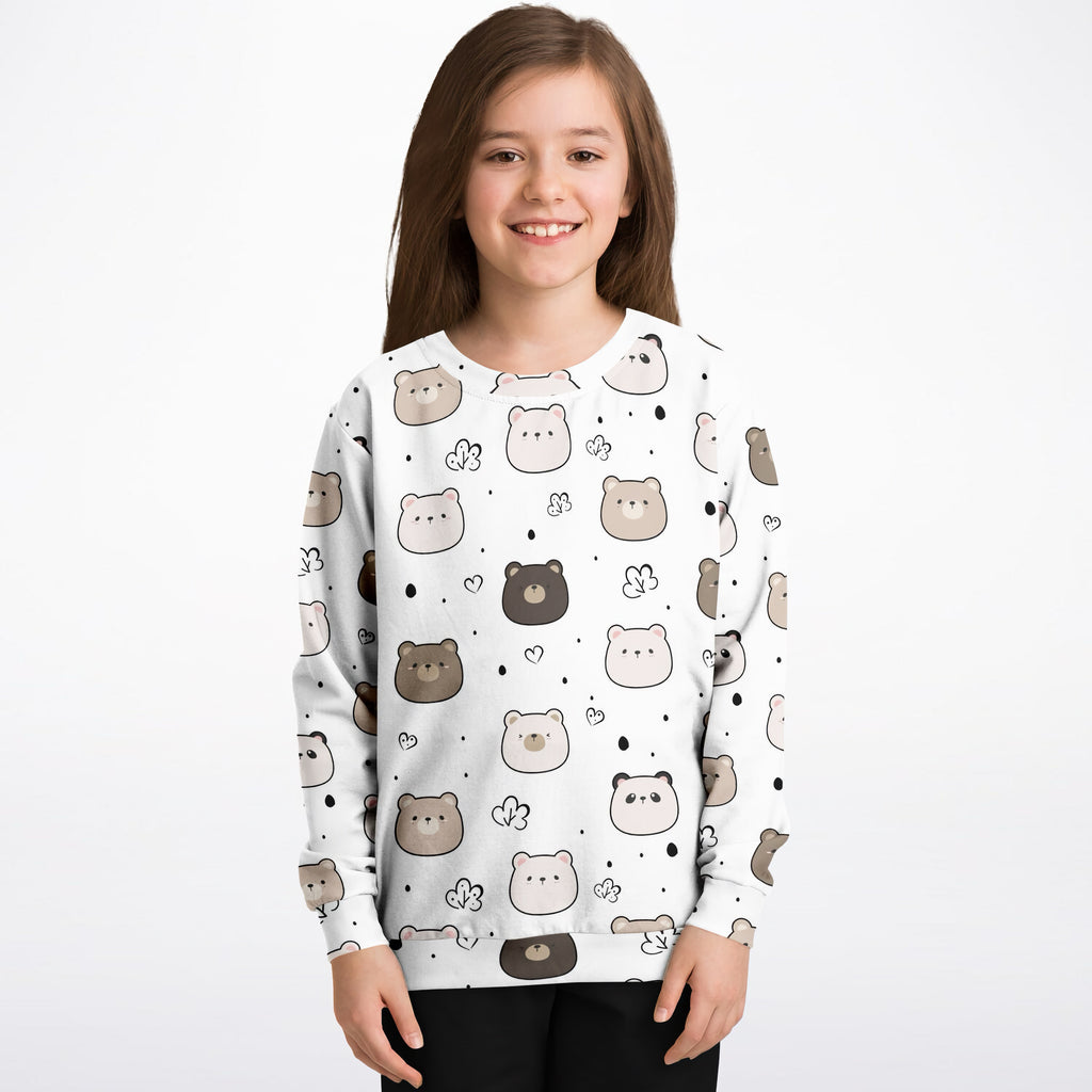 White long-sleeved kids sweatshirt with playful brown and beige bear pattern made of cozy cotton fleece