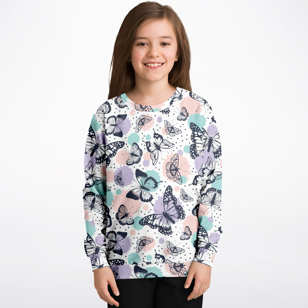 Girls butterfly sweatshirt in white cotton fleece with black purple and teal butterfly pattern and watercolor splashes