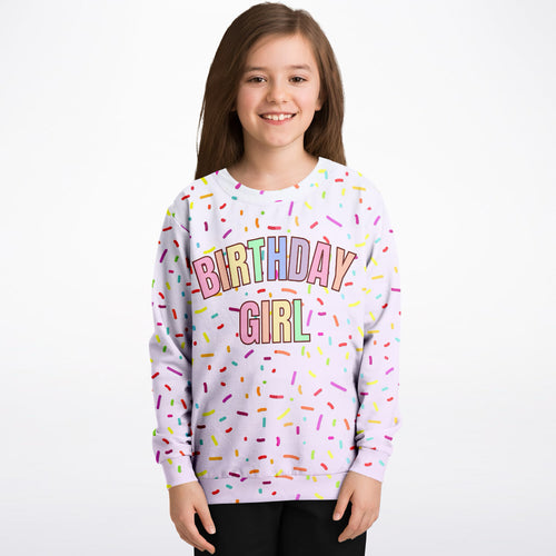 A soft lavender birthday girl sweatshirt with colorful rainbow sprinkles made from cozy cotton fleece or lightweight sports fabric