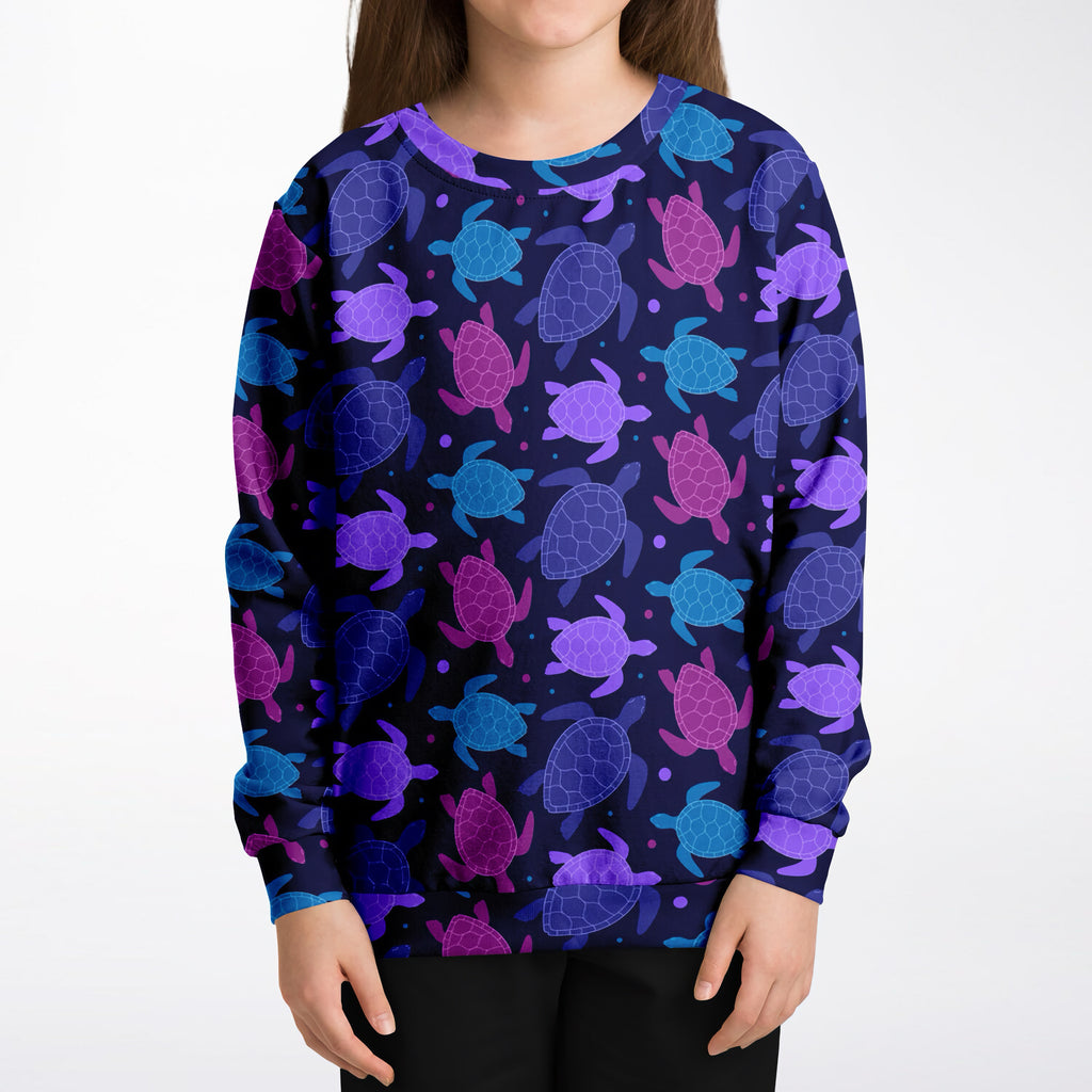 Girls purple sea turtle sweatshirt in navy blue with vibrant sea turtles in purple pink and teal made of cozy cotton fleece