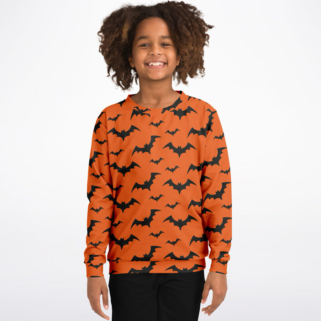 Kids orange long-sleeved sweatshirt with black bat pattern made of cozy cotton fleece or lightweight sports fabric for Halloween