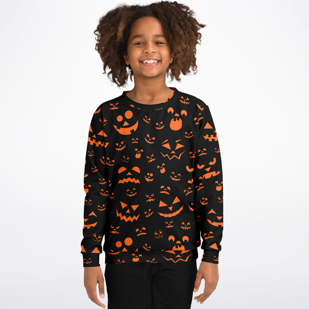 Kids jack-ol-lantern halloween sweatshirt in black cotton fleece with vibrant orange pumpkin face pattern