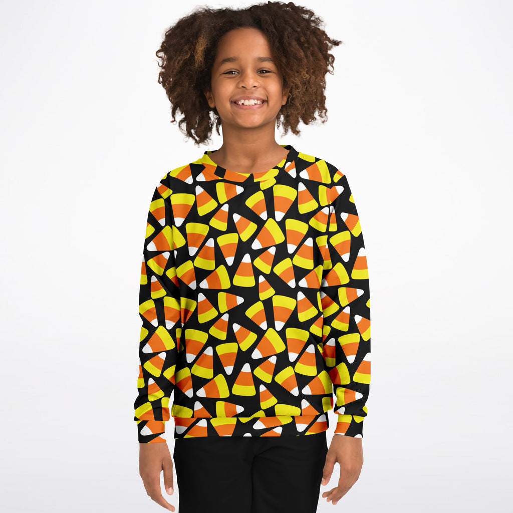 Kids candy corn halloween sweatshirt black long-sleeved cozy cotton fleece with vibrant candy corn pattern
