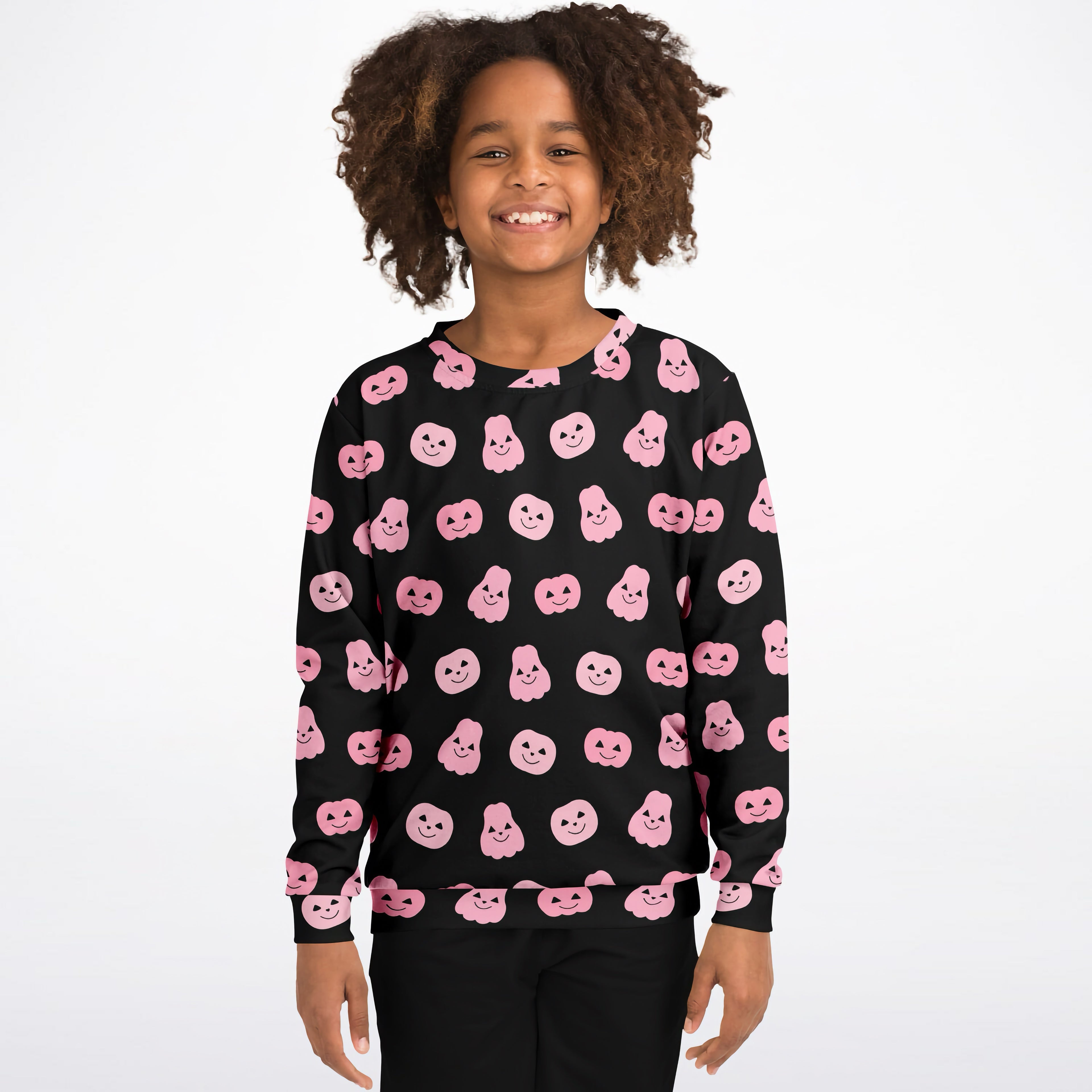 Black girls sweatshirt with pink cartoon pumpkin faces printed all over in cozy cotton fleece for halloween