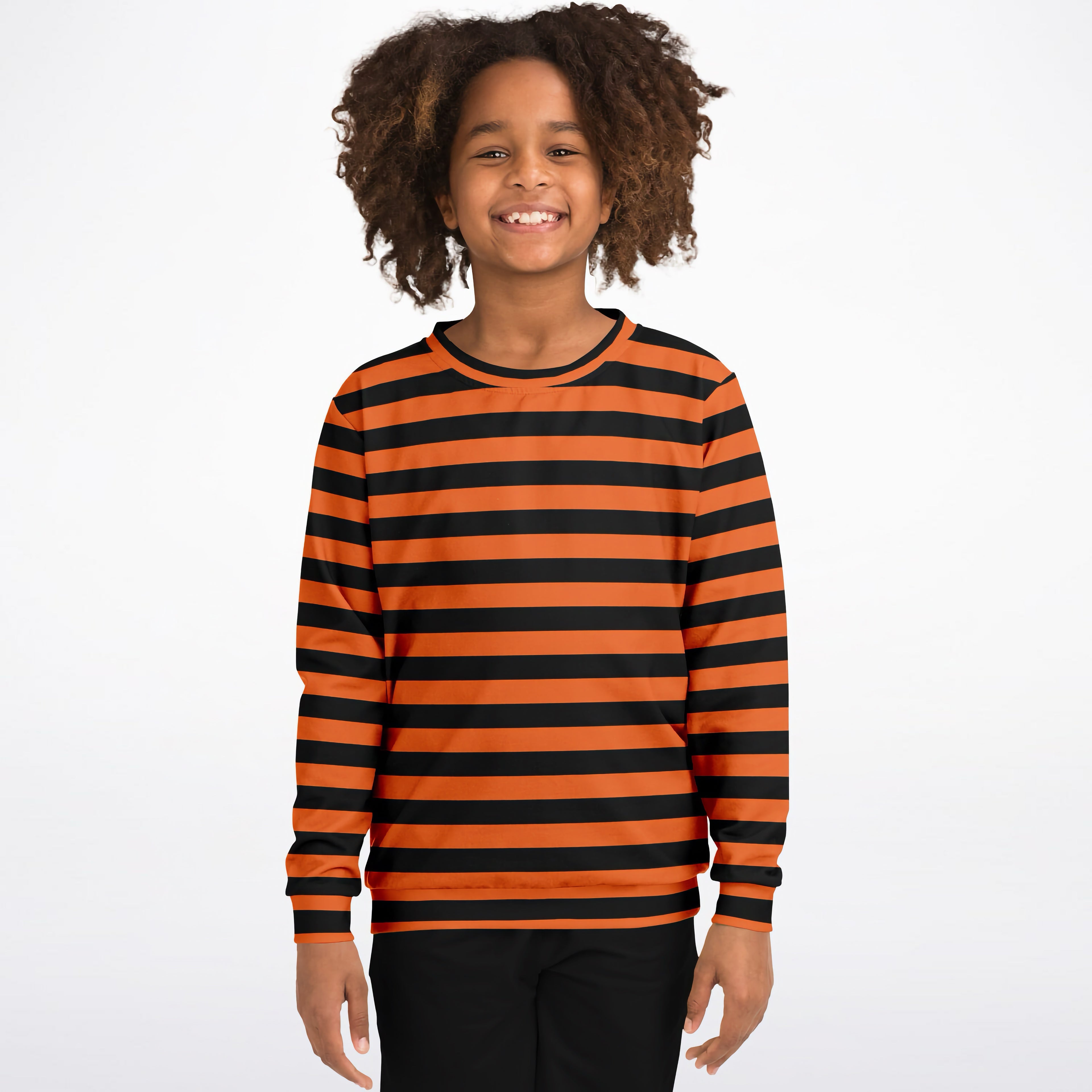 A child wearing a kids orange and black striped Halloween sweatshirt made of cozy cotton fleece with ribbed cuffs
