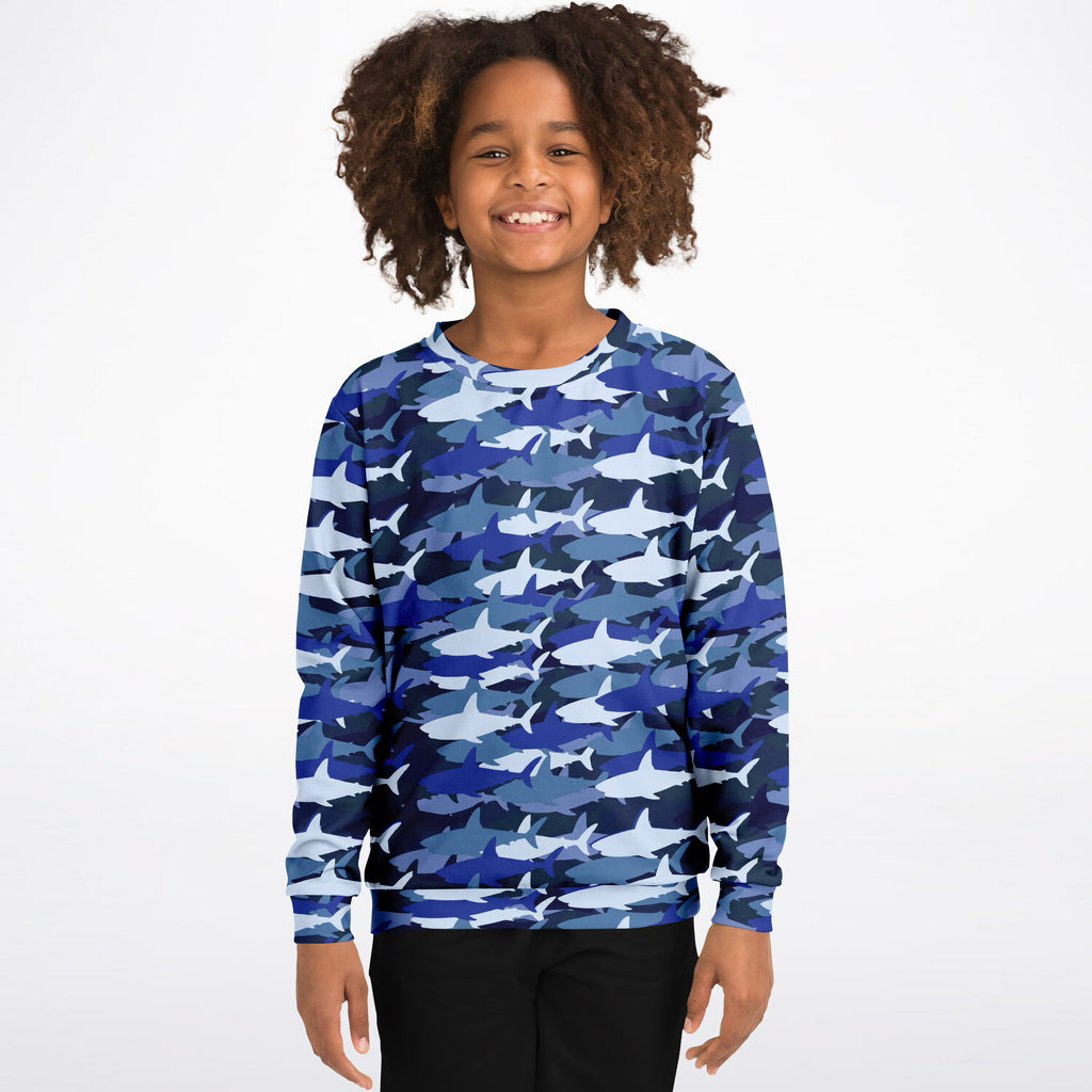 Kids blue shark sweatshirt with white shark pattern made from cozy cotton fleece or lightweight sports fabric