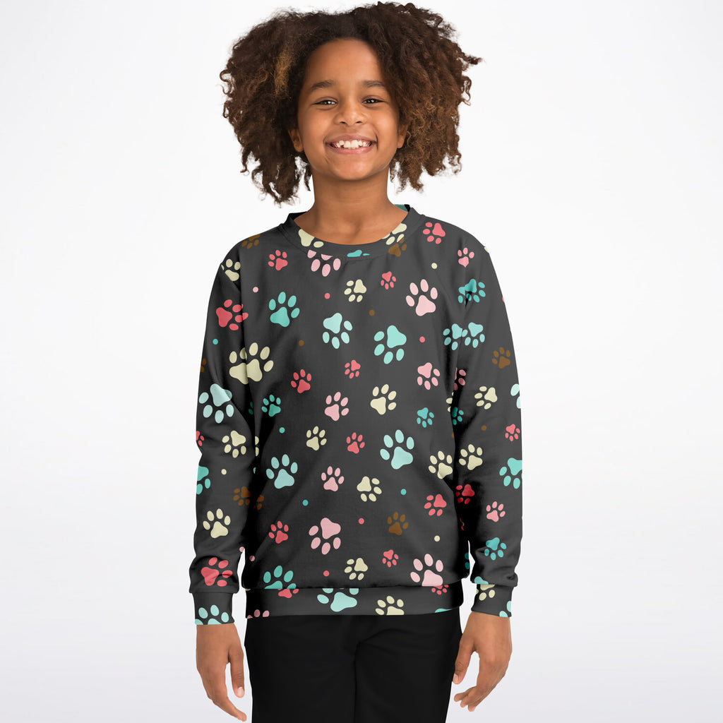 Dark gray kids colorful paw print sweatshirt in cozy cotton fleece with pink teal cream and brown paw patterns
