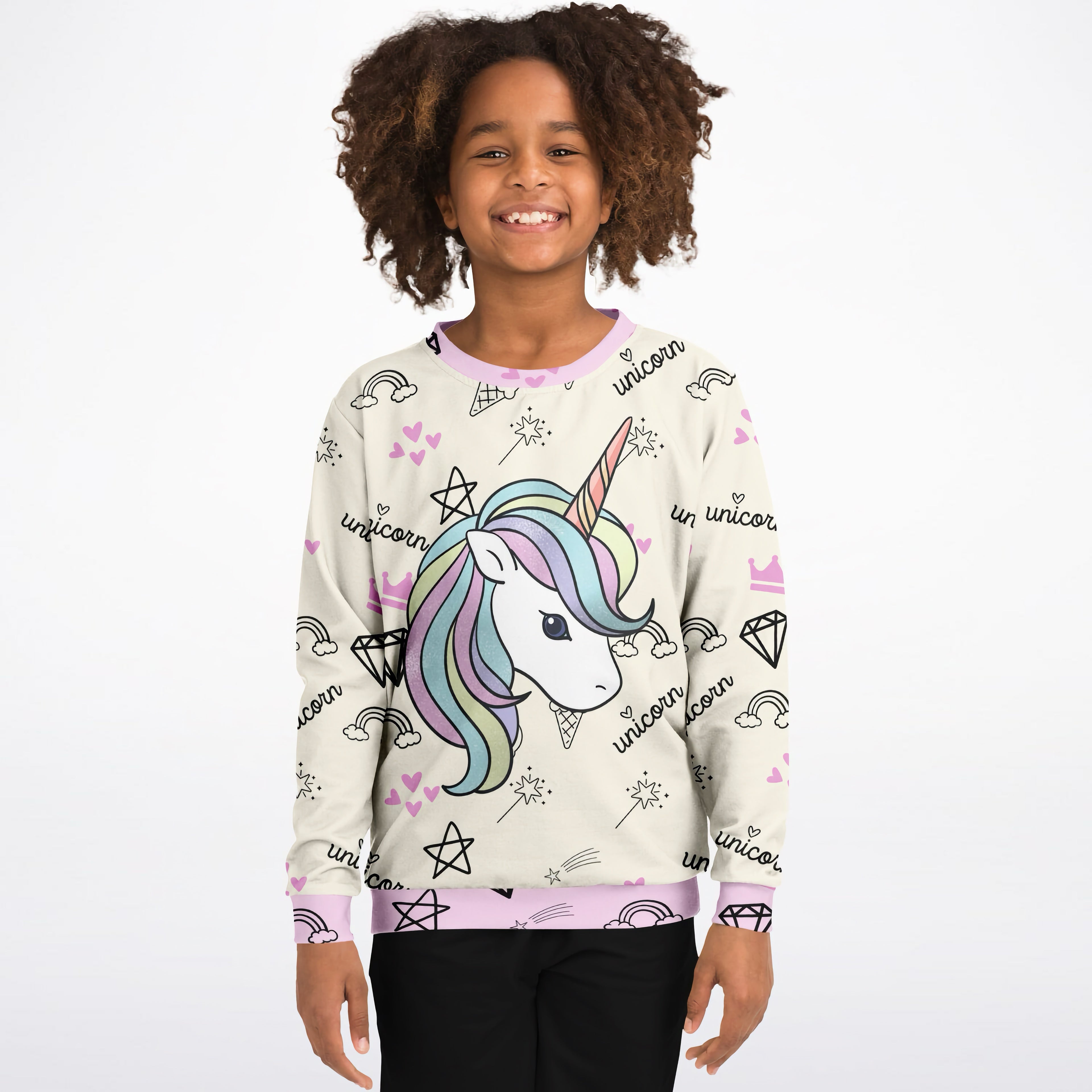A child wearing a girls magical unicorn sweatshirt in cream cotton fleece with pastel mane and pink accents