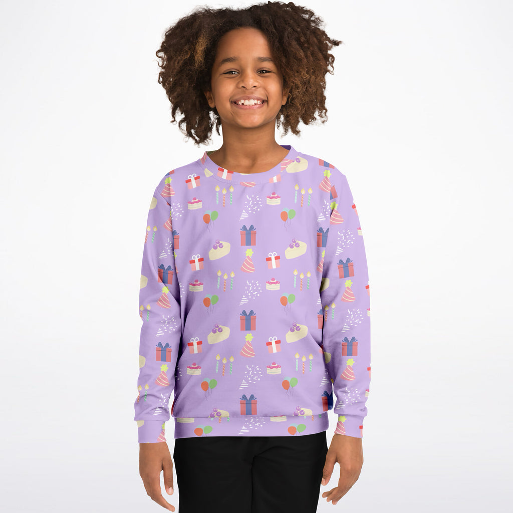 Girls purple birthday pattern sweatshirt in cozy cotton fleece with playful cakes presents and balloons print