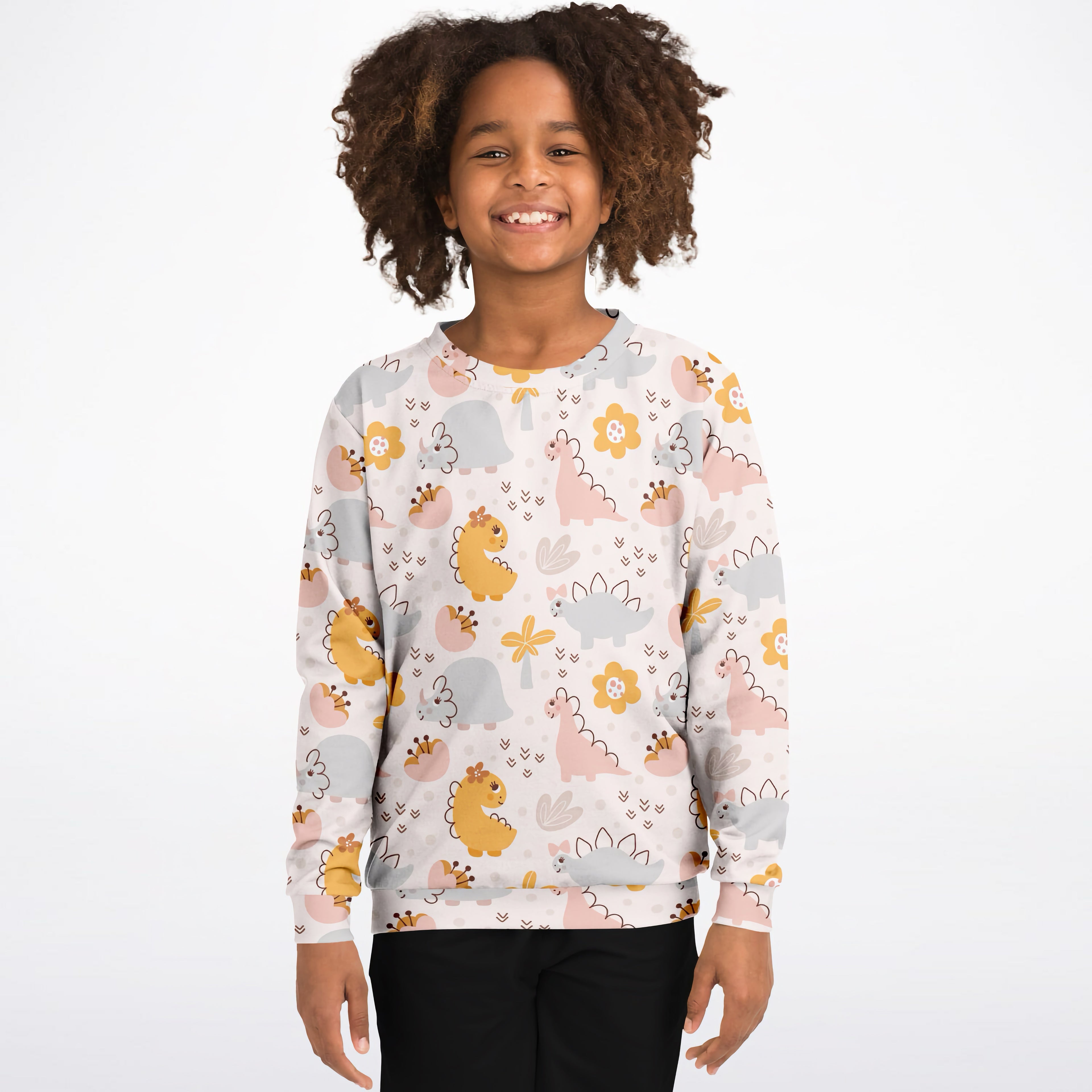 A child wearing a girls floral dinosaur sweatshirt in white cotton fleece with pastel dinosaur and flower patterns