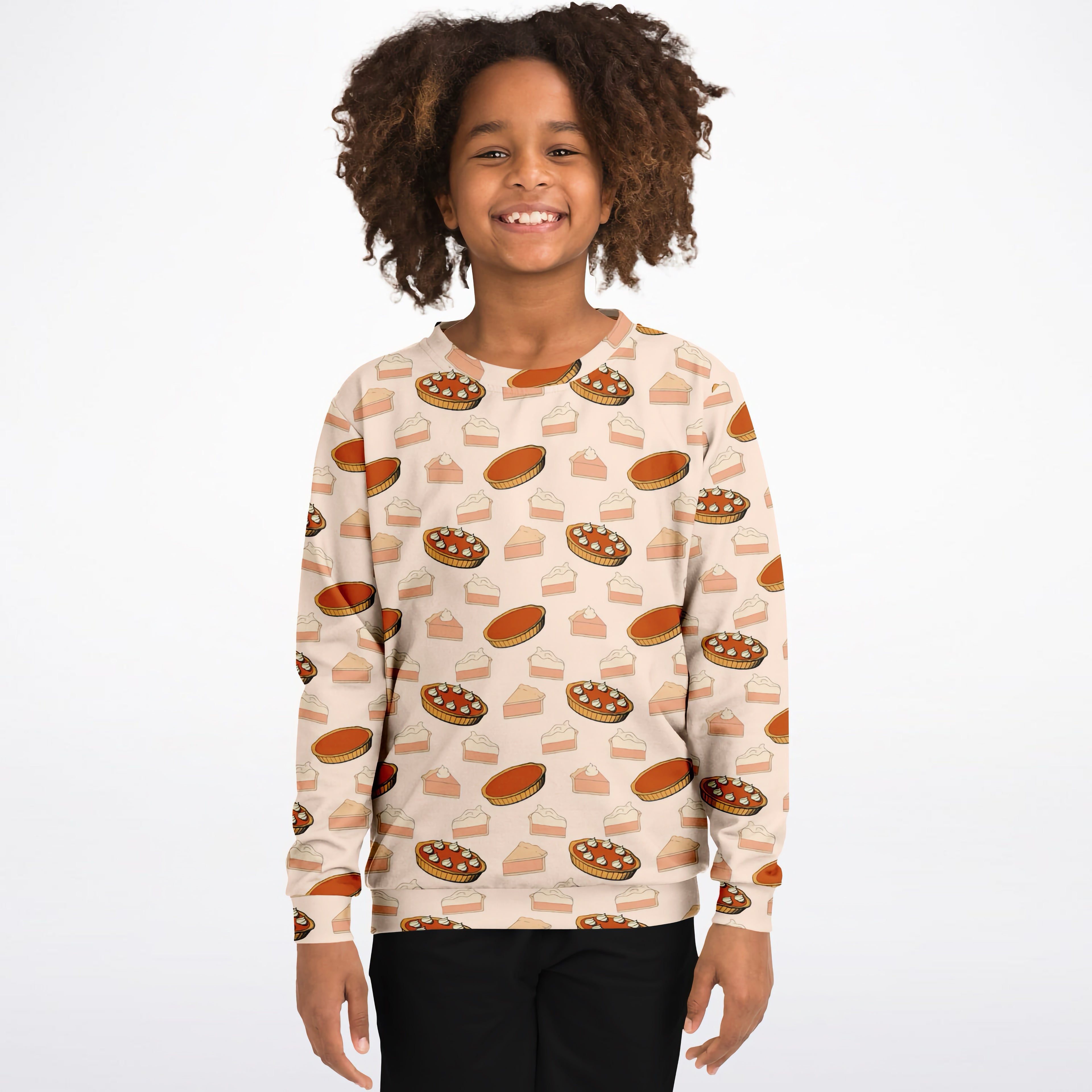 A child wearing a beige kids pumpkin pie thanksgiving sweatshirt with orange pie pattern in cozy cotton fleece