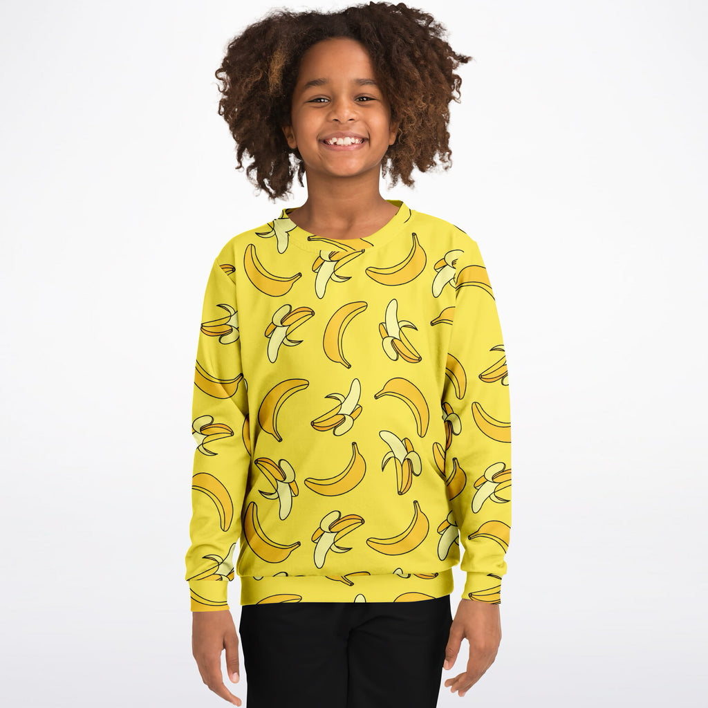 Kids yellow banana sweatshirt with playful cartoon banana print made of cozy cotton fleece or lightweight sports fabric