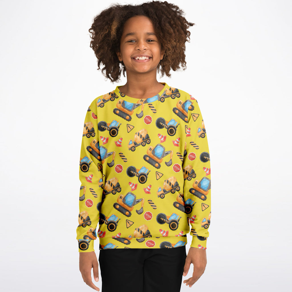 Bright yellow kids construction themed sweatshirt with playful vehicle print made of cozy cotton fleece