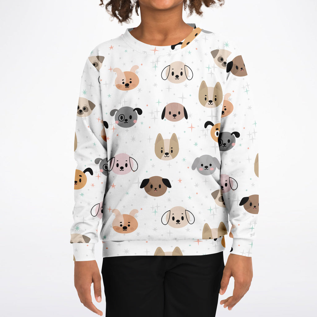 White long-sleeved kids sweatshirt with playful cartoon dog faces in earthy beige brown and gray tones