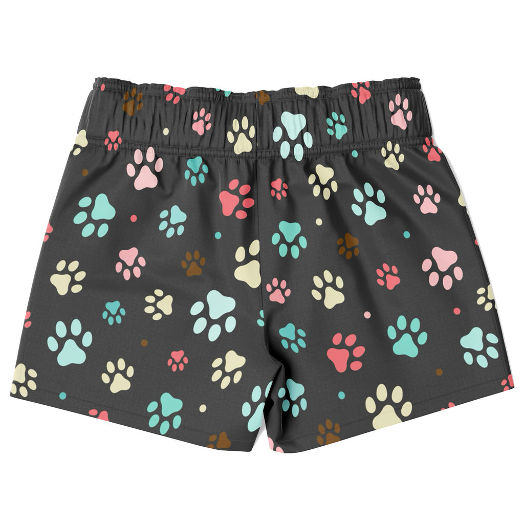 Black boys quick drying swim trunks with colorful paw print pattern in pink teal cream and brown