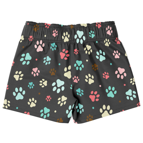 Black boys quick drying swim trunks with colorful paw print pattern in pink teal cream and brown