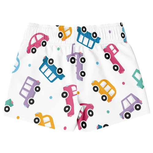 White boys quick drying swim trunks with colorful cartoon cars in pink blue yellow and purple playful pattern