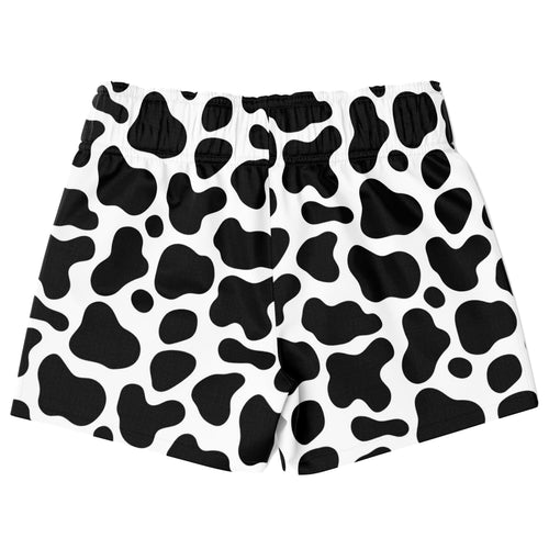 Boys cow print quick drying swim trunks featuring black and white cow pattern for comfortable water use
