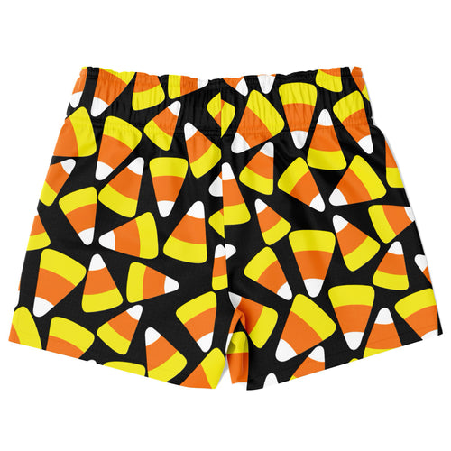 Boys candy corn quick drying swim trunks in black with vibrant orange yellow and white candy corn pattern