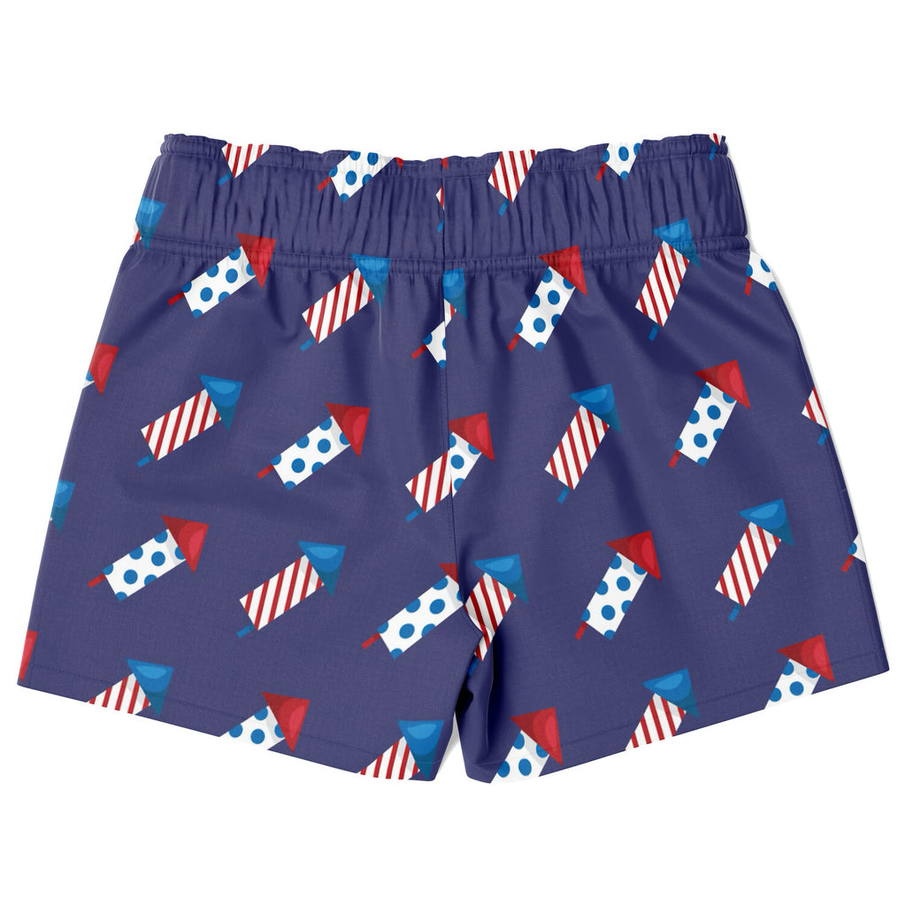 Navy blue boys firework rocket quick drying swim trunks with red white and blue fireworks pattern